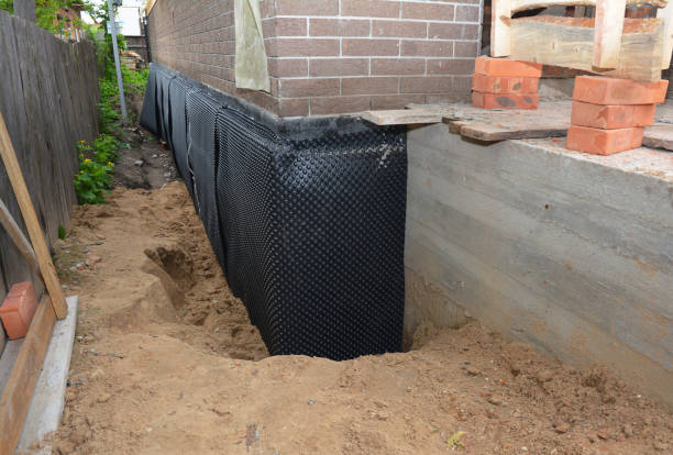 Happy homeowners after waterproofing job in Sawyerville